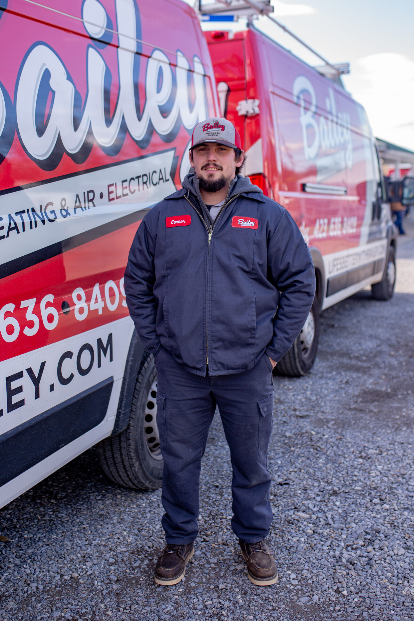 Bailey Heating & Air technician helping a homeowner